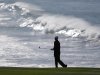 Cameron Percy of Australia follows his shot from the fairway to the ninth green of the Pebble Beach Golf Links during a practice round of the AT&T Pebble Beach Pro-Am golf tournament Wednesday, Feb. 6, 2013 in Pebble Beach, Calif. (AP Photo/Eric Risberg)