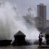 Waves pound the boardwalk, the Malecon, during the passing of Tropical Storm Isaac in Havana Cuba, Sunday, Aug. 26, 2012. The hurricane center said the storm, which was swirling north of the central coast of Cuba in the pre-dawn hours, was expected to be near or over the Florida Keys sometime later Sunday or Sunday night. (AP Photo/Ramon Espinosa)