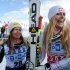 Lindsey Vonn, right, of the United States, celebrates with her teammate third placed Julia Mancuso, after winning an alpine ski, women's World Cup super-G, in St. Moritz, Switzerland, Saturday, Dec .8, 2012. (AP Photo/Giovanni Auletta)