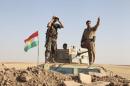 Kurdish peshmerga troops participate in an intensive security deployment against Islamic State militants on the front line in Khazer