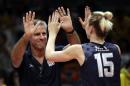United States head coach Karch Kiraly celebrates with Kim Hill after a women's preliminary volleyball match against China at the 2016 Summer Olympics in Rio de Janeiro, Brazil, Sunday, Aug. 14, 2016. (AP Photo/Matt Rourke)