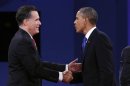 U.S. President Obama and Republican Presidential nominee Romney shake hands at the conclusion of the final presidential debate at Lynn University in Boca Raton
