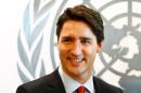 Justin Trudeau, Prime Minister of Canada pauses as he visits United Nations Secretary-General Ban Ki-moon at the UN in New York on March 16, 2016