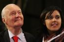 Former Labour Party cabinet minister Benn smiles next to his granddaughter Emily after she addressed the annual Labour Party conference in Bournemouth