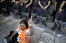 A municipal worker shouts slogans outside the Interior Ministry during a rally in Athens