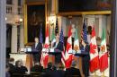 U.S. Secretary of State John Kerry, center, speaks at a news conference with Canadian Foreign Minister John Baird, left, and Mexican Foreign Secretary Jose Antonio Meade at Faneuil Hall in Boston Saturday, Jan. 31, 2015. (AP Photo/Winslow Townson)