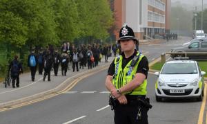 A police officer stands guard as pupils arrive&nbsp;&hellip;