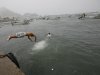 A man jumps into the harbor water before the arrival of the Hurricane Jova in Manzanillo, Mexico,Tuesday Oct. 11, 2011. Jova roared toward a collision Tuesday night with a vulnerable Mexican coastline dotted with tourist resorts and flood-prone mountain villages, prompting evacuations and shutting down one of the country's top cargo ports. (AP Photo/Marco Ugarte)