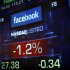 Monitors show the value of the Facebook, Inc. stock during morning trading at the NASDAQ Marketsite in New York