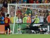 Spanish midfielder Cesc Fabregas (L) scores the winning penalty