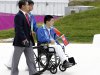 In this  Monday, Aug., 27, 2012 photo, North Korea's only competitor Rim Ju Song, sits in his wheelchair during the team's welcoming ceremony at the London 2012 Paralympic games in London.  Rim Ju Song, who actually lives in Beijing and lost an arm and leg in a construction accident, became his country's only hope. The problem: He couldn't really swim. The first training session was a disaster. He sank "like a rock," recalled Kim Sung Chol of the North Korean Paralympic Committee. Nevertheless, he soon learned the crawl stroke and in May, Rim and his coaches boarded a plane for Berlin and his first international competition. (AP Photo/Alastair Grant)