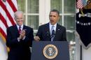 President Barack Obama, with Vice President Joe Biden, speaks in the Rose Garden of the White House in Washington, Tuesday, April 1, 2014, about the Affordable Care Act. The deadline to sign up for health insurance under the Affordable Care Act passed at midnight Monday night. (AP Photo/Carolyn Kaster)