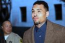 R&B singer Chris Brown arrives at a Los Angeles Superior Court for a probation review hearing on Monday, Feb. 3, 2014, in Los Angeles. The judge rejected a prosecutor's request during the hearing to have Brown sent to jail over the misdemeanor assault case filed last year in Washington, D.C. (AP Photo/Nick Ut)