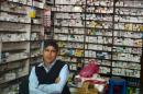 A Nepalese pharmacist waits for customers in Kathmandu, where protests at the border with India have led to crippling shortages of fuel and now a lack of medical supplies