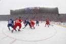 The Toronto Maple Leafs and the Detroit Red Wings face off during the first period of the Winter Classic outdoor NHL hockey game at Michigan Stadium in Ann Arbor, Mich., Wednesday, Jan. 1, 2014. (AP Photo/Paul Sancya)