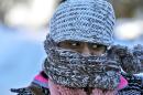 Nyjaii Williams, of St. Paul, is bundled up against the cold wind, Sunday, Jan. 26, 2014, in St. Paul. (AP Photo/The Star Tribune, Marlin Levison) MANDATORY CREDIT; ST. PAUL PIONEER PRESS OUT; MAGS OUT; TWIN CITIES TV OUT