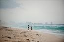 A couple walks on Playa del Carmen beach, Quintana Roo State, Mexico on October 25, 2011