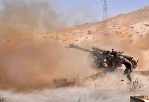 A Syrian soldier fires artillery shells towards Islamic &hellip;
