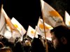 Protestors hold Cyprus' flags during a rally outside the parliament in capital Nicosia, Cyprus, Friday, March 22, 2013. Cypriot authorities were putting the final touches Friday to a plan they hope will convince international lenders to provide the money the country urgently needed to avoid bankruptcy within days. “The next few hours will determine the future of this country,” said government spokesman Christos Stylianides. (AP Photo/Petros Karadjias)