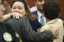 George Zimmerman's wife, Shellie hugs her Father-in-law Robert Zimmerman Sr. after her husband was found not guilty in the 2012 shooting death of Trayvon Martin at the Seminole County Criminal Justice Center in Sanford Florida