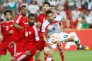 Reza Ghoochannejhad (right) of Iran battles for the ball during the Asian Cup Group C encounter against the United Arab Emirates in Brisbane on January 19, 2015