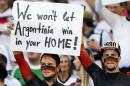 German supporters hold up a banner before the World Cup final soccer match between Germany and Argentina at the Maracana Stadium in Rio de Janeiro, Brazil, Sunday, July 13, 2014. (AP Photo/Matthias Schrader)