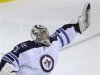 Winnipeg Jets' goalie Ondrej Pavelec makes a save against the Washington Capitals in the third period of their NHL hockey game in Washington