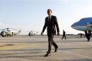U.S. President Obama walks from Air Force One upon his arrival at Kennedy Airport in New York
