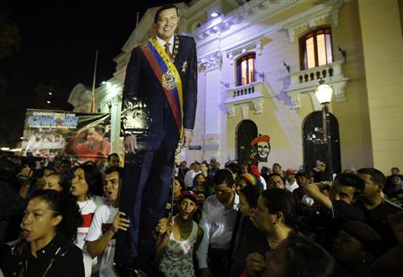Supporters of Venezuela's President Hugo Chavez react to the announcement of his death outside Miraflores Palace in Caracas, March 5, 2013. REUTERS/Carlos Garcia Rawlins