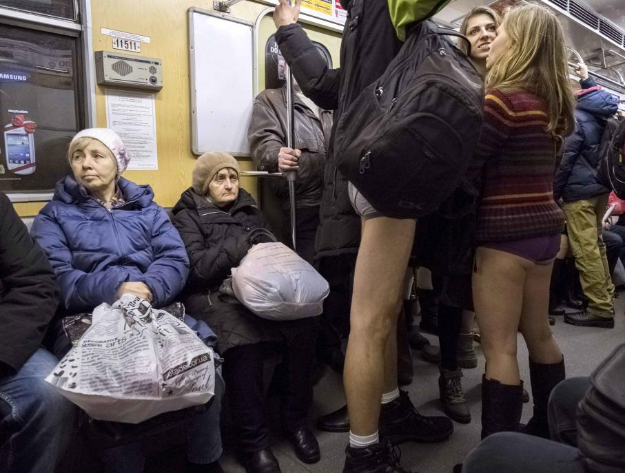 Passengers without pants ride a subway train during the "No Pants Subway Ride" in Kiev