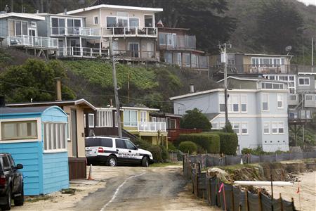 A San Mateo County sheriff deputy vehicle is seen on a private road in Martin's Beach, a popular surfing and fishing spot, in Half Moon Bay, California March 14, 2013. REUTERS/Robert Galbraith