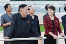 North Korean leader Kim Jong-Un and an unidentified woman visit the Rungna People's Pleasure Ground, which is nearing completion, in Pyongyang