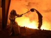 A steel-worker is pictured at a furnace at the plant of German steel company Salzgitter AG in Salzgitter