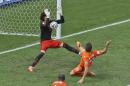 Mexico's goalkeeper Guillermo Ochoa makes a save after a shot by Netherlands' Klaas-Jan Huntelaar during the World Cup round of 16 soccer match between the Netherlands and Mexico at the Arena Castelao in Fortaleza, Brazil, Sunday, June 29, 2014. (AP Photo/Themba Hadebe)