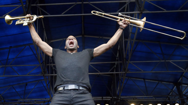Trombone Shorty performs at the Newport Jazz Festival in Newport, R.I., Saturday, Aug. 2, 2014. The historic event was the first outdoor jazz festival and has played host to some of the most famous acts and memorable performances in jazz. (AP Photo/Michael Dwyer)