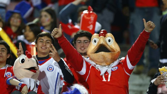 Chile fans wear masks of Chile&#39;s popular comic character &quot;Condorito&quot; as they await the start of the team&#39;s quarter-finals Copa America 2015 soccer match against Uruguay at the National Stadium in Santiago