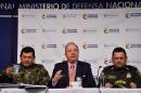 Colombian Defense Minister Luis Carlos Villegas (C), Army Forces Commander General Juan Pablo Rodriguez (L) and Director of Police Jorge Nieto attend a press conference to talk about the full ceasefire between the FARC and the government