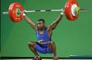 Oscar Albeiro Figueroa Mosquera, of Colombia, competes in the men's 62kg weightlifting competition at the 2016 Summer Olympics in Rio de Janeiro, Brazil, Monday, Aug. 8, 2016. (AP Photo/Mike Groll)