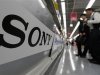 File photo of a Sony logo seen as customers look at Sony digital cameras at an electronics shop in Tokyo