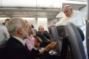 Pope Francis answers reporters questions during a news conference aboard the papal flight on its way back from Brazil, Monday, July 29, 2013. Pope Francis reached out to gays on Monday, saying he wouldn't judge priests for their sexual orientation in a remarkably open and wide-ranging news conference as he returned from his first foreign trip. "If someone is gay and he searches for the Lord and has good will, who am I to judge?" Francis asked. His predecessor, Pope Benedict XVI, signed a document in 2005 that said men with deep-rooted homosexual tendencies should not be priests. Francis was much more conciliatory, saying gay clergymen should be forgiven and their sins forgotten. Francis' remarks came Monday during a plane journey back to the Vatican from his first foreign trip in Brazil. (AP Photo/Luca Zennaro, Pool)