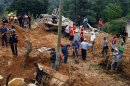 Rescuers and volunteers help after a landslide in Altotonga, State of Veracruz, Mexico, on September 16, 2013