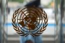 A security guard walks past the United Nations logo at the U.N. Headquarters in New York