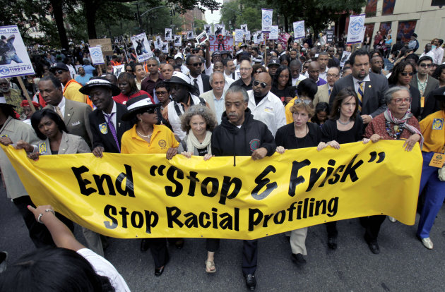 FILE - In this Sunday, June 17, 2012 file photo, Rev. Al Sharpton, center, walks with thousands along Fifth Avenue, during a silent march to end the "stop-and-frisk" program in New York. A federal trial is scheduled to begin in New York on Monday, March 18, 2013, where the NYPD’s practice of stopping, questioning and frisking people on the street will face a sweeping legal challenge. The outcome could bring major changes to the nation's largest police force and could affect how other departments use the stop and frisk tactic. (AP Photo/Seth Wenig, File)