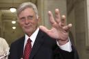 Arkansas Gov. Mike Beebe waves as he talks to reporters in a hallway at the Arkansas state Capitol in Little Rock, Ark., Wednesday, Nov. 5, 2014. (AP Photo/Danny Johnston)