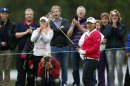 Yani Tseng of Taiwan and spectators react after a shot at the Suzann Pro Golf Challenge in Oslo
