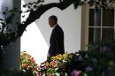 President Barack Obama walks out of the Oval Office towards the South Lawn of the White House in Washington, Friday, Aug. 29, 2014, as he travels to Westchester County, N.Y., and Newport, R.I. (AP Photo/Charles Dharapak)