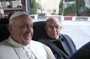 In this photo released by the National Conference of Brazilian Bishops, Pope Francis, left, is seen aboard a minibus with other Cardinals at the Vatican, the day after his election, Thursday, March 14, 2013. (AP Photo/CNBB, Antonio Luiz Catelan)