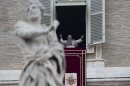 Pope Benedict XVI greets the faithful during the Angelus noon prayer he celebrated from the window of his studio overlooking St. Peter's Square, at the Vatican, Sunday, Nov. 4, 2012. (AP Photo/Andrew Medichini)