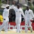 Sri Lanka's captain Jayawardene celebrates with Paranavitana and Jayawardene after taking wicket of New Zealand's Flynn during fourth day of second and final test cricket match in Colombo