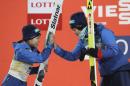 Second placed Japan's Sara Takanashi, left, gets a high-five with winner Japan's Yuki Ito, right, during the award ceremony for the Normal Hill Individual of the FIS Ski Jumping World Cup in Pyeongchang, South Korea, Wednesday, Feb. 15, 2017. (AP Photo/Lee Jin-man)